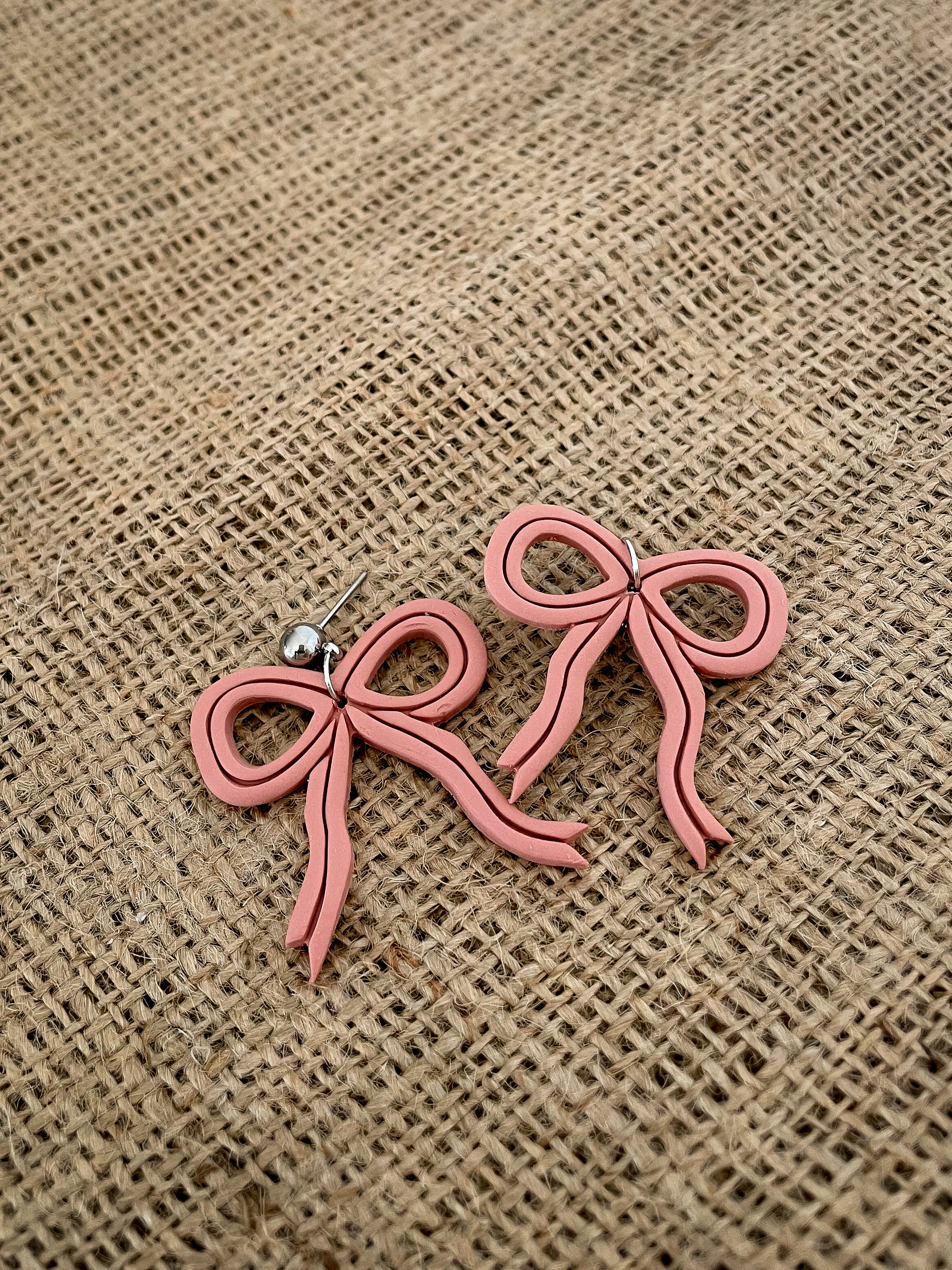 Dusty Pink Bow Dangly Stud Earrings